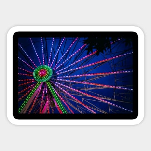 Colorful Ferris Wheel in Pink and Green in Blue Hour nigh sky Sticker